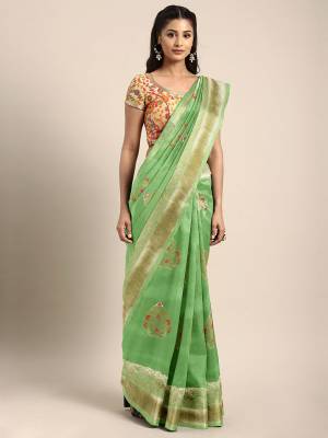Celebrate This Festive Season In Traditional Look Wearing This Silk Based Saree In Light Green Color. This Saree And Blouse are Fabricated On Art Silk Beautified With Weave All Over. 