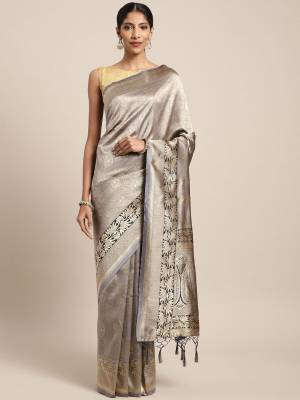 Silk Saree Always Gives A Rich And Elegant Look To Your Personality. Grab This Deisgner Silk Based Saree In Grey Color Beautified With Heavy Weave All Over. This Saree And Blouse Are Fabricated On Art Silk. Buy Now.