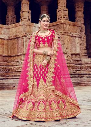 Get Ready For Your D-Day With This Heavy Designer Bridal Lehenga Choli In All Over Dark Pink Color. Its Heavy Embroidered Blouse And Lehenga Are Fabricated On Velvet Paired With Net Fabricated Dupatta. It Is Beautified With Heavy Jari Embroidery And Stone Work. Buy Now.