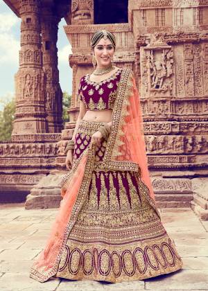 Grab This Very Beautiful And Heavy Designer Lehenga Choli In Purple Color Paired With Contrasting Dark Peach Colored Dupatta. Its Blouse And Lehenga Are Fabricated On Velvet Paired With Net Fabricated Dupatta. Its Fabric And Color Will Definitely Earn You Lots Of Compliments From Onlookers. Buy This Beautiful Designer Piece Now. 