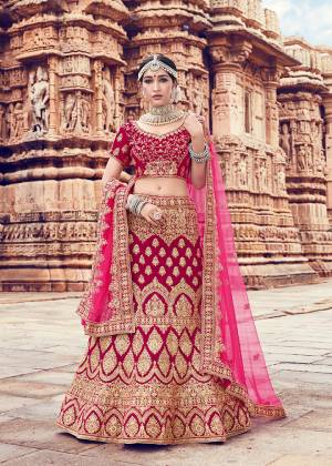 Grab This Very Beautiful And Heavy Designer Lehenga Choli In Magenta Pink  Color Paired With Pink Colored Dupatta. Its Blouse And Lehenga Are Fabricated On Velvet Paired With Net Fabricated Dupatta. Its Fabric And Color Will Definitely Earn You Lots Of Compliments From Onlookers. 