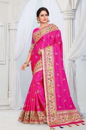 Here Is A Very Pretty Designer Silk Based Saree In Rani Pink Color . This Saree And Blouse Are Fabricated On Soft Art Silk Beautified With Multi Colored Thread Work Over The Boder And Small Butti Work Over The Saree. Its Rich Fabric Gives An Enhanced Look To Your Personality And Also It Is Durable And Easy To Care For. 