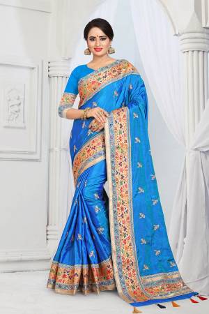 Here Is A Very Pretty Designer Silk Based Saree In Blue Color . This Saree And Blouse Are Fabricated On Soft Art Silk Beautified With Multi Colored Thread Work Over The Boder And Small Butti Work Over The Saree. Its Rich Fabric Gives An Enhanced Look To Your Personality And Also It Is Durable And Easy To Care For. 