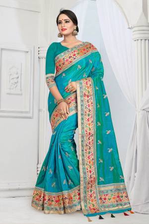 Here Is A Very Pretty Designer Silk Based Saree In Turquoise Blue Color . This Saree And Blouse Are Fabricated On Soft Art Silk Beautified With Multi Colored Thread Work Over The Boder And Small Butti Work Over The Saree. Its Rich Fabric Gives An Enhanced Look To Your Personality And Also It Is Durable And Easy To Care For. 