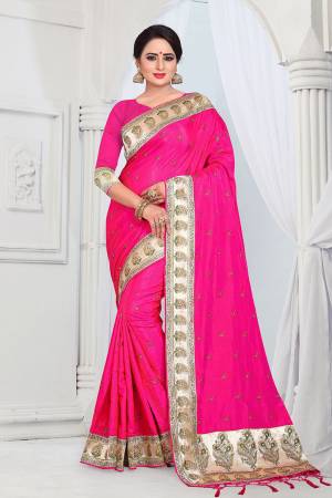 Evergreen Patterned Designer Saree Is Here For All Occasion Wear. This Attractive Looking Rani Pink Colored Saree And Blouse Are Fabricated On Soft Art Silk Beautified With Heavy Embroidered Lace Border. This Saree Is Light Weight And Easy To Carry All Day Long. 