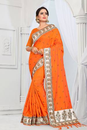Evergreen Patterned Designer Saree Is Here For All Occasion Wear. This Attractive Looking Orange Colored Saree And Blouse Are Fabricated On Soft Art Silk Beautified With Heavy Embroidered Lace Border. This Saree Is Light Weight And Easy To Carry All Day Long. 