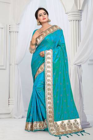 Evergreen Patterned Designer Saree Is Here For All Occasion Wear. This Attractive Looking Turquoise Blue Colored Saree And Blouse Are Fabricated On Soft Art Silk Beautified With Heavy Embroidered Lace Border. This Saree Is Light Weight And Easy To Carry All Day Long. 