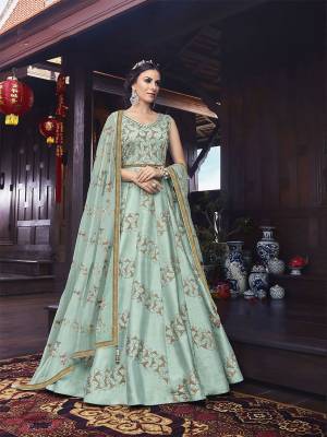 Very Pretty Is Here With This Designer Floor Length Suit In Aqua Blue Color. Its Pretty Embroidered Top Is Fabricated On Art Silk Paired With Santoon Bottom And Net Fabricated Dupatta. Buy Now.