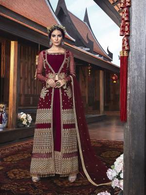 Are You Looking For A Unique Look, Than This Maroon Colored Indo-Western Dress Is Prefect You. It Comes With A Georgette Based Blouse And Bottom Paired With Embroidered Net Fabricated Jacket And Dupatta. Style This Unique Look For The Upcoming Festive And Wedding Season. 