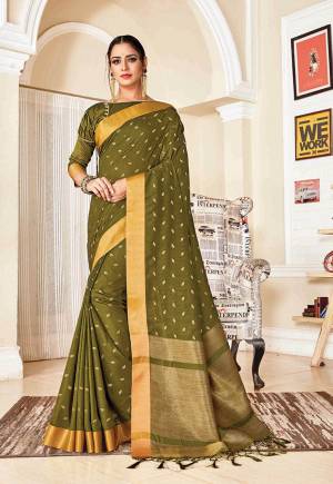 Flaunt Your Rich And Elegant Taste In Silk With This Subtle Weaved Saree In Olive Green Color. This Saree And Blouse Are Fabricated On Art Silk Beautified With Pretty Small Butti Weave All Over It. Its Silk Based Fabric Will Give A Rich Look To Your Personality.