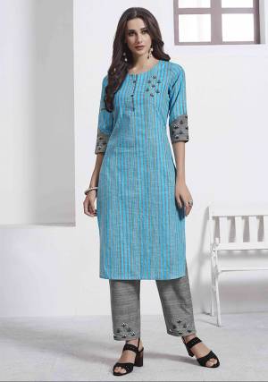 Grab This Very Pretty Pair Of Readymade Kurti And Pant. This Pretty Kurti Is In Blue Color Paired With Grey Colored Bottom. Its Top Is Cotton Based Paired With Khadi Cotton Fabricated Bottom, Beautified With Thread Work. 