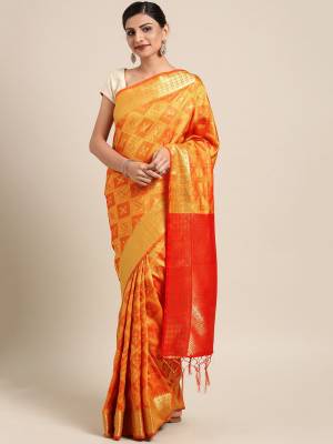 Celebrate This Festive Season In Traditional Look Wearing This Silk Based Saree In Orange Color. This Saree And Blouse are Fabricated On Kanjivaram Art Silk Beautified With Weave All Over