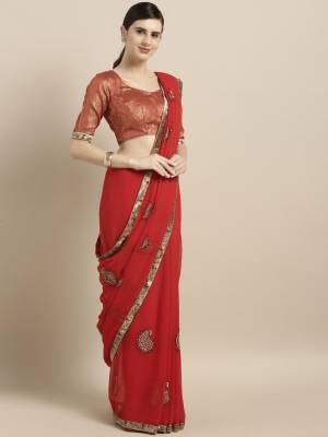 Adorn The Pretty Angelic Look In This Minimal Embroidered Saree In Red Color Paired With Red Colored Blouse. This Saree Is Fabricated On Georgette Paired With Art Silk Fabricated Blouse. It Is Beautified With Small Embroidered Motifs. 