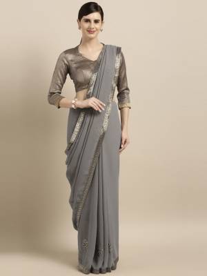 For A Bold And Beautiful Look, Grab This Very Beautiful And Elegant Looking Designer Saree In Grey Color Paired With Grey Colored Blouse. This Saree Is Fabricated On Georgette Paired With art Silk Blouse. Buy Now.