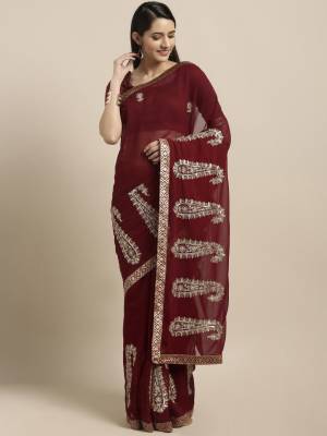 Adorn The Pretty Angelic Look In This Minimal Embroidered Saree In Maroon Color Paired With Maroon Colored Blouse. This Saree Is Fabricated On Chiffon Paired With Art Silk Fabricated Blouse. It Is Beautified With Small Embroidered Motifs. 