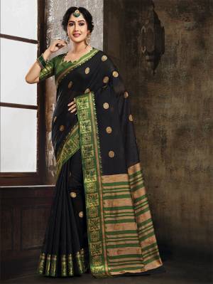 For A Bold And Beautiful Look, Grab This Designer Saree In Black Color Paired With Green Colored Blouse. This Saree And Blouse are Fabricated On Art Silk Beautified With Weave All Over. 