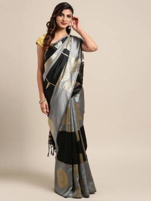 Celebrate This Festive Season In Traditional Look Wearing This Silk Based Saree In Black & Grey Color. This Saree And Blouse are Fabricated On Kanjivaram Art Silk Beautified With Weave All Over