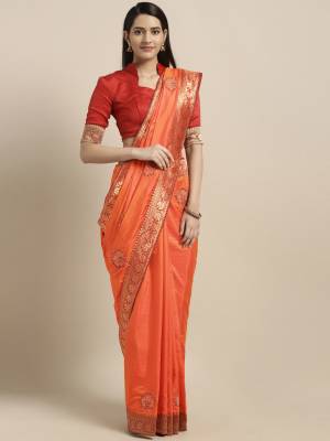 This Festive Season Have A Proper Traditonal Look With This Silk Based Embroidered Saree. This Saree Is In Orange Color Paired With Contrasting Red Colored Blouse. It Is Beautified With Lace Border & Embroidered Butti.
