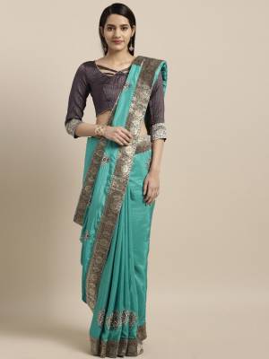 Add Thid Pretty Designer Silk Based Saree To Your Wardrobe In Blue Color Paired With Contrasting Navy Blue Colored Blouse. Its Silk Fabric Will Give A Rich Look To Your Personality. 