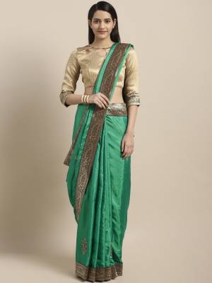 Enhance Your Personality Wearing This Designer Saree In Sea Green Color Paired With Contrasting Cream Colored Blouse. This Saree And Blouse Are Silk Based Beautified With Weave Lace Border And Embroiderd Butti. 