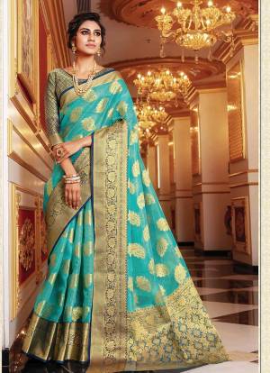 Enhance Your Personality In This Lovely Silk Based Designer Saree?In Blue Color Paired With Contrasting Green Colored Blouse. This Saree And Blouse Are Fabricated On Handloom Art Silk Which Gives A Rich Look To Your Personality.