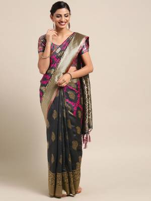 Celebrate This Festive Season In Traditional Look Wearing This Silk?Based Saree In Black Color. This Saree And Blouse are Fabricated On Banarasi Art Silk Beautified With Weave All Over