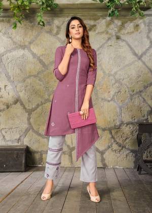 Add This Pretty Readymade Pair Of Kurti In Mauve Color Paired With Contrasting Grey Colored Bottom. Its Top And Bottom Are Fabricated On Rayon Beautified With Thread Work. It Is Available In All Regular Sizes. Buy This Pretty Pair Now.