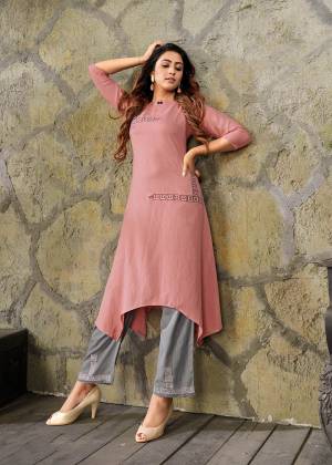 Look Pretty Wearing This Readymade Pair Of Kurti In Dusty Pink Color Paired With Contrasting Grey Colored Bottom. This Kurti And Bottom are Fabricated On Rayon Beautified With Thread Work. Buy This Pretty Piece Now. 