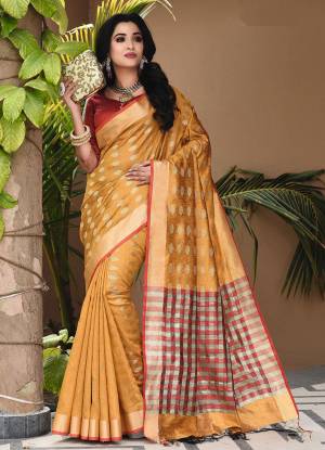 Enhance Your Personality Wearing This Saree In Musturd Yellow Color Paired With Contrasting Red Colored Blouse. This Saree And Blouse Are Fabricated On Art Silk Beautified With Small Butti Weave All Over. Buy This Saree Now.