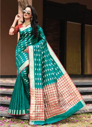 For A Bold And Beatiful Look Grab This Lovely Saree In Teal Blue Color Paired With Red Colored Blouse. This Saree And Blouse Are fabricated On Art Silk Beautified With Weave. Its Fabric Is Light Weight And Durable Which Is Easy To Carry All Day Long. 