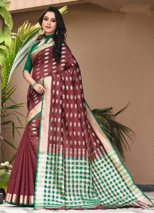 Shine Bright In This Designer Weaved Saree In Maroon Color Paired With Contrasting Green Colored Blouse. This Saree And Blouse Are Fabricated On Art Silk Which Gives A Rich Look To Your Personality. 