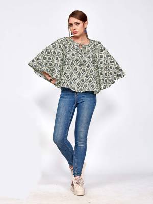 For Your College, Home Or Work Place, Grab This Designer Readymade Top In Pastel Green And Black Color Beautified With Small Prints All Over It. It Is Light In Weight And Easy To Carry All Day Long. 
