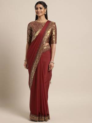 The fabulous pattern makes this saree a classy number to be included in your wardrobe. maroon color bright georgette saree. Ideal for party, festive & social gatherings. this gorgeous saree featuring a beautiful mix of designs. Its attractive color and designer silk saree, stone design, beautiful floral design Saree along with silk jacquard Blouse, work over the attire & contrast hemline adds to the look.