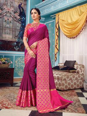 Here Is A Pretty Silk Based Saree In Same Family Color Saree And Blouse. This Pretty Saree Is In Magenta Pink Color Paired With Rani Pink Colored Blouse. It Is Beautified With Weave Over The Broad Saree Border Giving It An Attractive Look. 