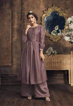 Here Is Very Pretty New Shade In Purple To Add Into Your Wardrobe With This Readymade Designer Kurti And Plazzo In Mauve Color. Its Top And Bottom Are Fabricated On Soft Silk Beautified With Foil Prints And Embroidery. Buy Now.