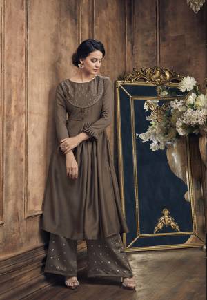 Enhance Your Personality Wearing This Rich Looking Designer Pair Of Kurti And Plazzo In Brown Color Which Is Soft Silk Based. Its Top Is Beautified With Jari And Resham Embroidered Paired With Foil Printed Bottom. 