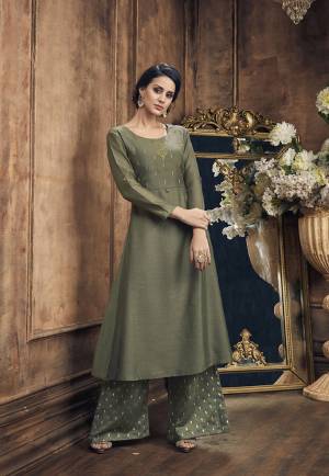 You Will Definitely Earn Lots Of Compliments Wearing This Designer Readymade Pair Of Kurti And Plazzo In Olive Green Color. This Readymadde Pair Is Fabricated On Soft Silk Beautified With Embroidery Over Top And Foil Printed Bottom. 