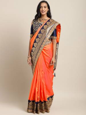 Bright And Visually Appealing Color IS Here With This Designer Saree In Orange Color Paired With Contrasting Navy Blue Colored Blouse. This Saree And Blouse Are Fabricated On Art Silk Beautified With Weave And Embroidery. Its Attractive Part Is Its Jacquard Silk Fabricated Pallu. 