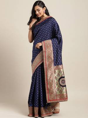 Look Pretty In This Designer Silk Based Saree In Navy Blue Color Paired With Red Colored Blouse. This Pretty Weaved And Embroidered Saree Is Beautified With Jacquard Silk Fabricated Pallu. Buy This Pretty Saree Now.