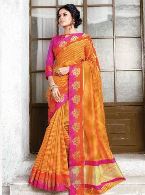 Celebrate This Festive Season Wearing Designer Silk Based Saree In Orange Color Paired With Contrasting Rani Pink Colored Blouse. It Has Very Pretty Checks Prints All Over With Weave Lace Border. Its Attractive Color Pallete And Fabric Will Earn You Lots Of Compliments From Onlookers. 