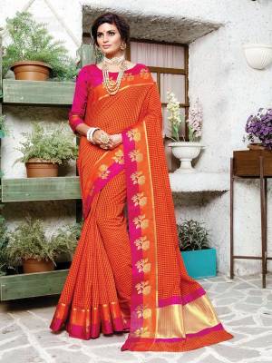 Celebrate This Festive Season Wearing Designer Silk Based Saree In Orange Color Paired With Contrasting Dark Pink Colored Blouse. It Has Very Pretty Checks Prints All Over With Weave Lace Border. Its Attractive Color Pallete And Fabric Will Earn You Lots Of Compliments From Onlookers. 