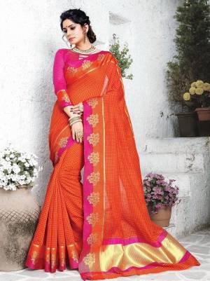 Celebrate This Festive Season Wearing Designer Silk Based Saree In Orange Color Paired With Contrasting Dark Pink Colored Blouse. It Has Very Pretty Checks Prints All Over With Weave Lace Border. Its Attractive Color Pallete And Fabric Will Earn You Lots Of Compliments From Onlookers. 