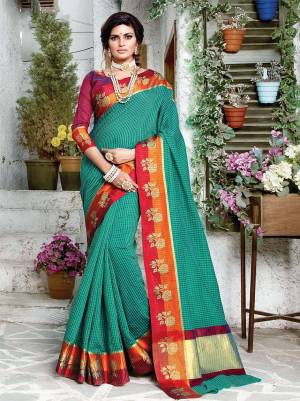 For A Proper Traditional Look, Grab This Designer Silk Based Saree In Teal Green Color Paired With Contrasting Maroon Colored Blouse. It Is Beautified With Checks Prints All Over With Weaved Lace Border. Buy Now.