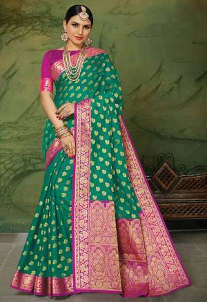 Celebrate This Festive Season With Beauty And Comfort In This Elegant Looking Designer Silk Based Saree In Sea Green Color. This Saree And Blouse Are Fabricated On Art Silk Beautified With Small Butti Weave All Over. Buy Now.