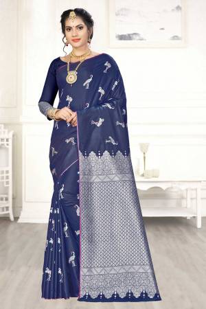 Enhance Your Personality Wearing This Designer Silk Based Saree In Navy Blue Color Paired With Navy Blue Colored Blouse. This Saree And Blouse Are Fabricated On Banarasi Art Silk Beautified With Pretty Motif Weave. 