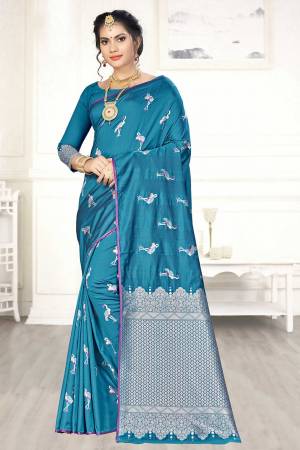 Enhance Your Personality Wearing This Designer Silk Based Saree In Blue Color Paired With Blue Colored Blouse. This Saree And Blouse Are Fabricated On Banarasi Art Silk Beautified With Pretty Motif Weave. 