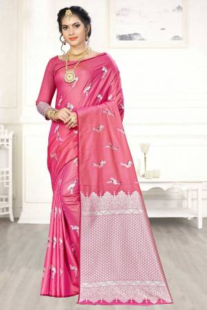 Enhance Your Personality Wearing This Designer Silk Based Saree In Pink Color Paired With Pink Colored Blouse. This Saree And Blouse Are Fabricated On Banarasi Art Silk Beautified With Pretty Motif Weave. 
