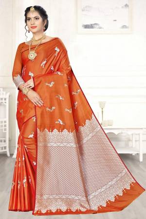 Enhance Your Personality Wearing This Designer Silk Based Saree In Orange Color Paired With Orange Colored Blouse. This Saree And Blouse Are Fabricated On Banarasi Art Silk Beautified With Pretty Motif Weave. 