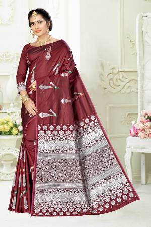 Enhance Your Personality Wearing This Designer Silk Based Saree In Maroon Color Paired With Maroon Colored Blouse. This Saree And Blouse Are Fabricated On Banarasi Art Silk Beautified With Pretty Motif Weave. 