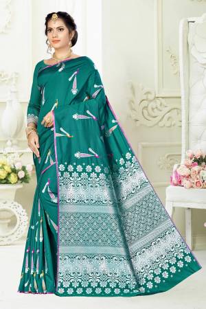 Enhance Your Personality Wearing This Designer Silk Based Saree In Teal Green Color Paired With Teal Green Colored Blouse. This Saree And Blouse Are Fabricated On Banarasi Art Silk Beautified With Pretty Motif Weave. 